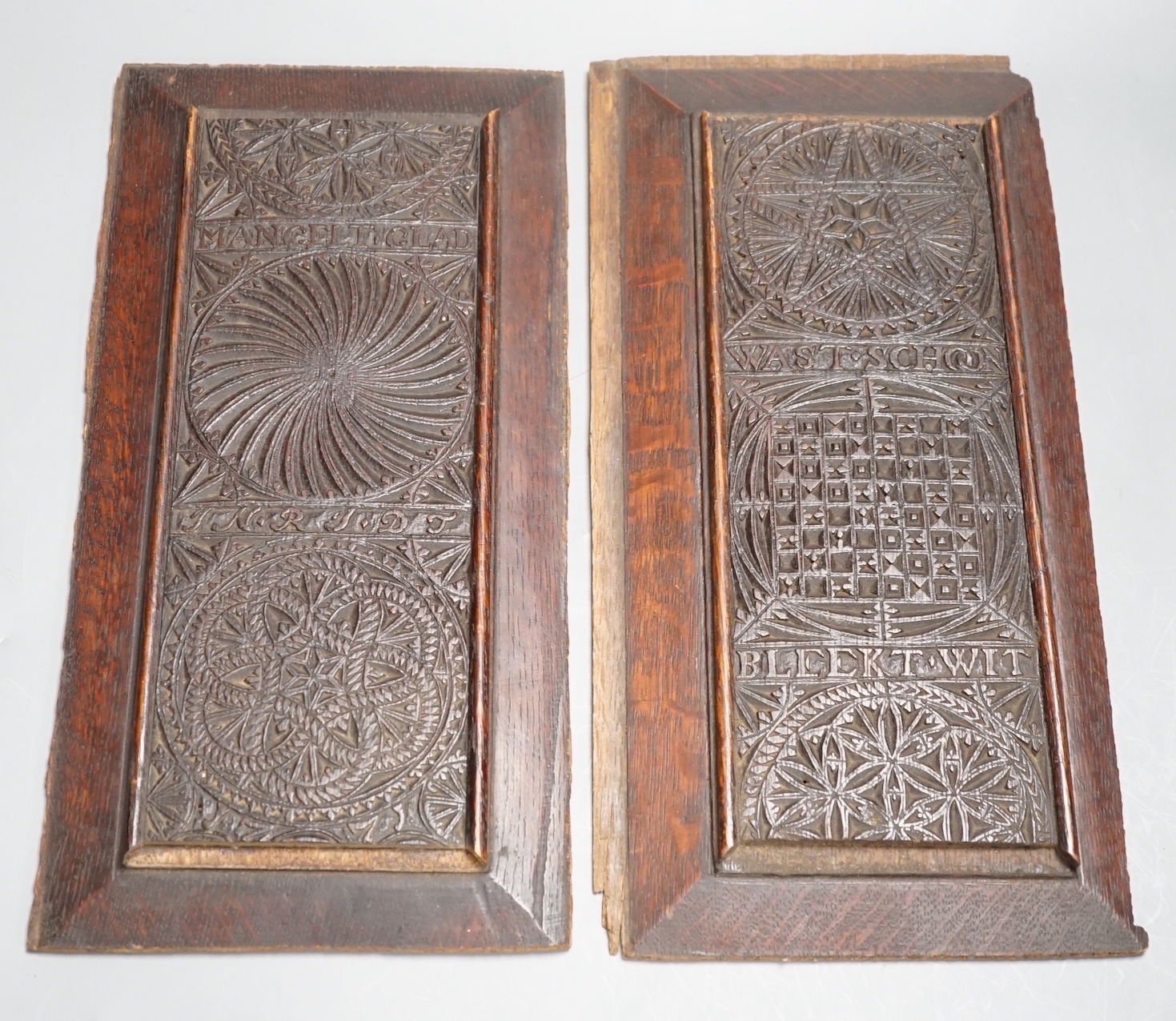 A pair of 18th century Scandinavian carved oak panels in later frames 18x36cm, possibly adapted from a mangle board